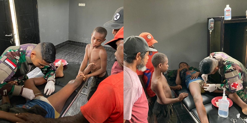 Satgas Yonif 122TS Bantu Mengobati Warga yang Terluka